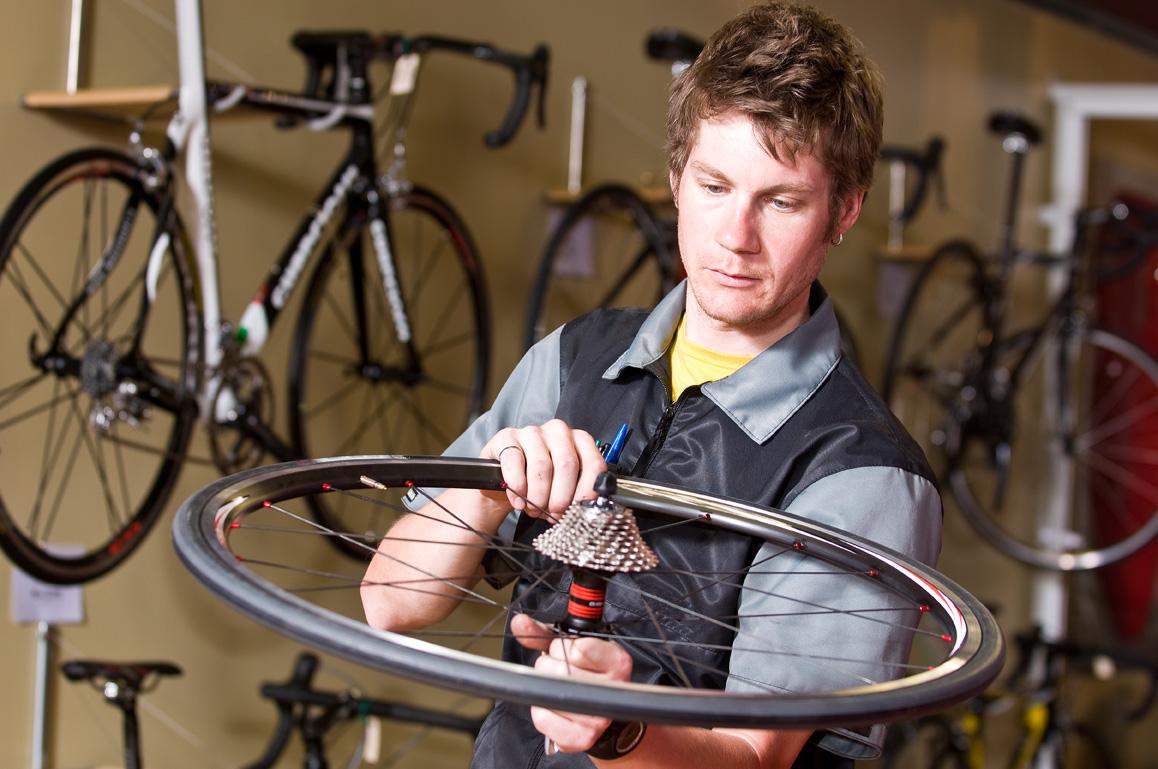 Bicycle drivetrain being serviced in a workshop